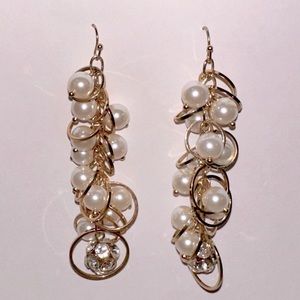 Dangling gold and pearl earrings. 3 inches long. $5